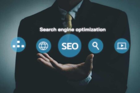 Hand businessman icon SEO Search engine optimization virtual sc